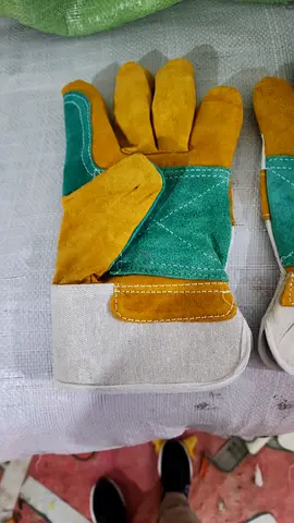 Pair of heavy-duty leather work gloves — good condition