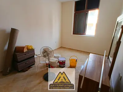 One bedroom and living room for annual rent in Al Alia, Ajman | Two bathrooms | Central air conditioning | Free maintenance by the owner | Close to am