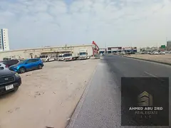 Residential/commercial land for sale in Al Rawda 3, Ajman – second plot from Street, area 9,859 sq