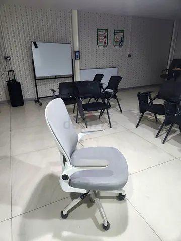 Light grey ergonomic office chair on wheels - good condition