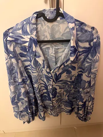 Lightweight blue and white floral women's blouse, size medium