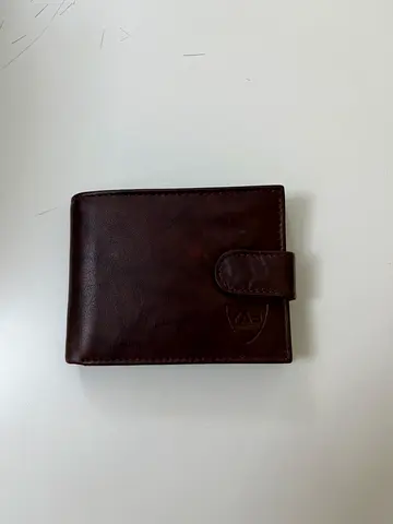Brown leather bi-fold wallet with snap closure - good condition