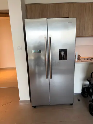 Hisense stainless steel side-by-side refrigerator with water dispenser