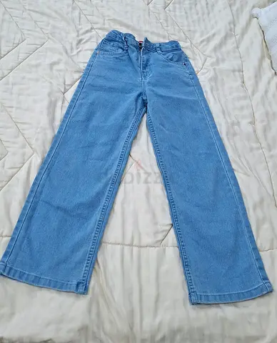 Light blue wide-leg kids jeans, size approximate 7_8years