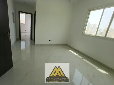 2 Bedroom Apartment for annual rent in Al Alia, Ajman. Brand new, balcony, 2 bathrooms, central AC, free maintenance, AED 36,000, 4 payments, prime lo
