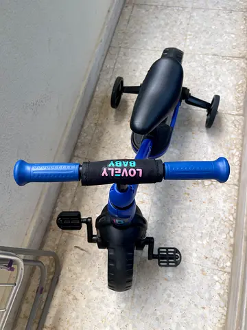 Blue toddler bike with stabilizer wheels — Lovely Baby