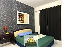 Two bedrooms and a living room/Balcony with an open view/Furnished/In Al Waha Towers Al Rashidiya 1,