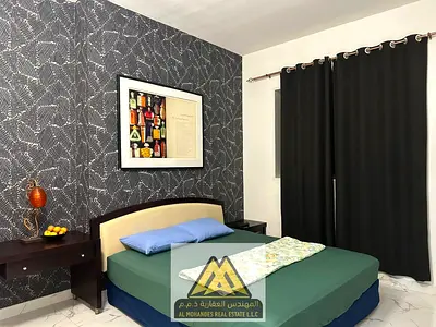 Two bedrooms and a living room/Balcony with an open view/Furnished/In Al Waha Towers Al Rashidiya 1, next to all services and main roads