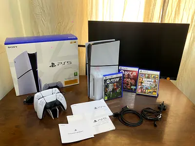 PlayStation 5 slim disk edition with charging dock and 27 inch samsung monitor