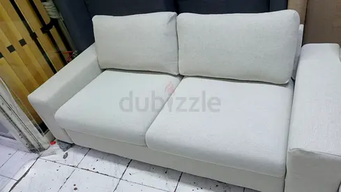 Light grey 2-seater fabric sofa in good condition