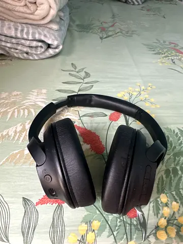 Gently used over-ear Bluetooth headphones - black