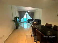 A distinctive, fully furnished apartment for annual rent in the Corniche Towers in Ajman, boasting a