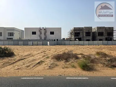Land for sale in Sharjah, Al Hooshi commercial area, two streets (front and back), freehold ownership for Arabs