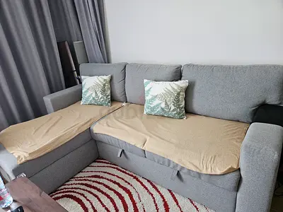 Grey L-shaped Sofa with Storage - Good Condition