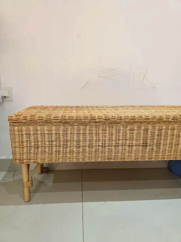 Wicker bench/storage chest with wooden legs - good condition