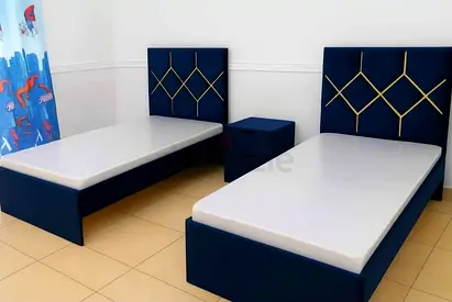 Pair of navy blue single beds with headboards and mattresses - set of 2
