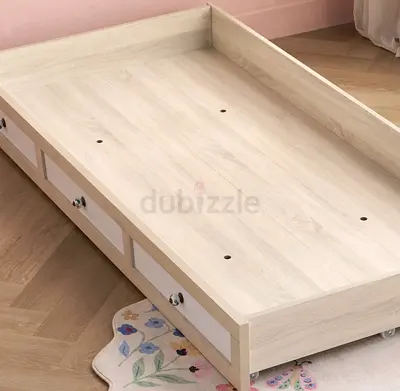 Single wooden trundle bed frame with drawer bed as well. Selling this with both mattresses