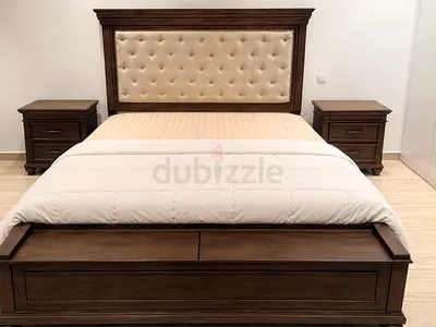 King-size dark wood bed with two wooden bedside tables and also includes king coil mattress
