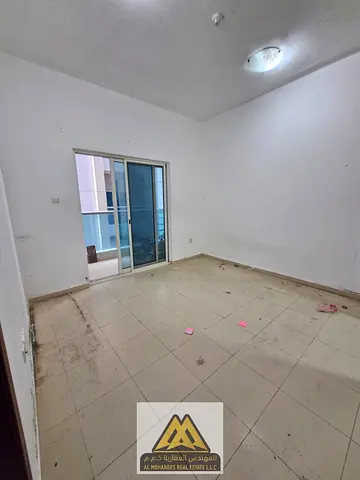One-bedroom apartment with a living room for annual rent in City Tower, Ajman. Suitable size, 2 bathrooms, no parking. Annual rent: AED 26,000, payabl