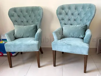 Pair of light blue tufted accent armchairs with wooden legs from Marina home