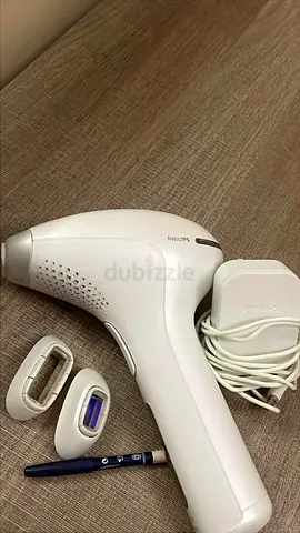Philips IPL hair removal device with charger and attachments - light use