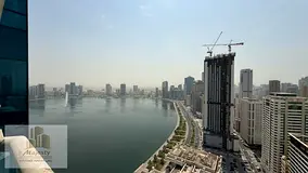 For sale: a unique apartment in Al-Dana Tower – Al Majaz 3, very high floor, luxurious finishing a