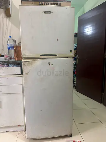 Used double-door refrigerator - needs cleaning