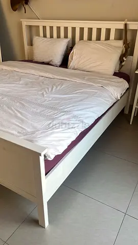 White wooden king bed frame with slatted headboard with mattress