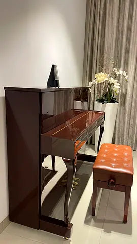 Upright glossy brown piano with bench - excellent condition