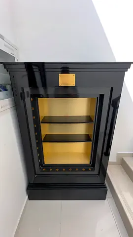 Black Display Cabinet with Glass Door and Gold Interior
