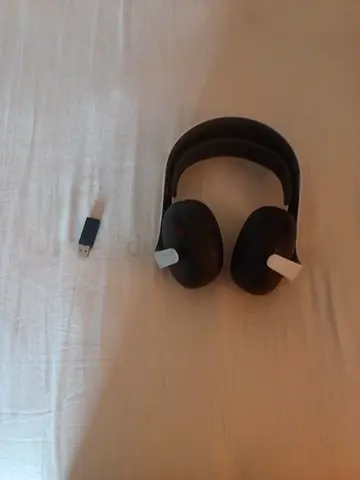 Black over-ear wireless headphones with USB dongle - good condition