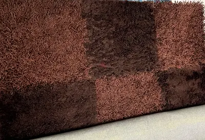 Brown shaggy checkered area rug - 170/270 -good condition for sale