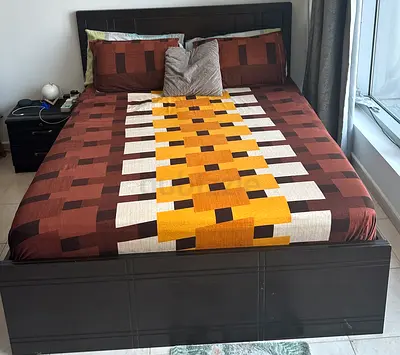 Dark wood queen bed frame with mattress