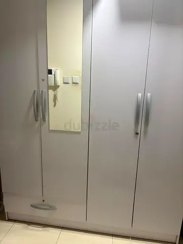 White 4-Door Wardrobe with Mirror and Bottom Drawer