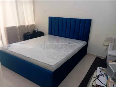 Blue upholstered double bed with mattress - good condition