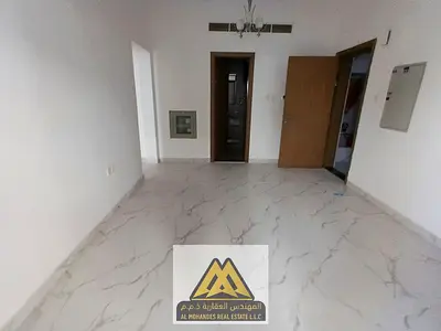 Two-bedroom apartment for annual rent in Al Alia, Ajman | Prime balcony, free maintenance, and stra