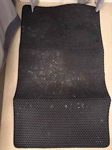Black rubber anti-slip floor mat (used) - non-slip hex pattern