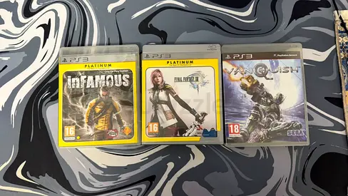 PS3 collectibles infamous, final fantasy XIII, vanquish