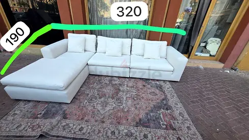 Looks good condition Marina home Feather filled sofa beige