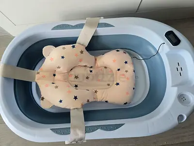 Foldable baby bathtub with padded infant support (used) - good condition