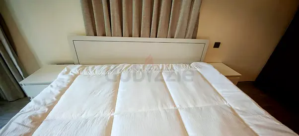 Modern White king size bed with 2 comodes and mattress. Used less than 4 months. Perfect condition.