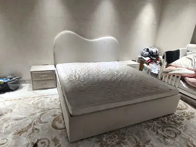 Queen upholstered bed frame with storage and mattress — light beige