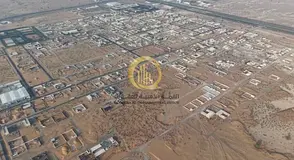 An industrial land in the Al Bataih area with a prime location, entrance from Al Dhaid Road and Khor