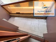 Studio with a balcony, separate kitchen, and split AC, with easy access to Sharjah and Dubai.
