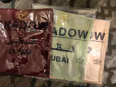Three new packaged Shadow Dubai hijabs/scarves - neutral tones (maroon, sage, beige)