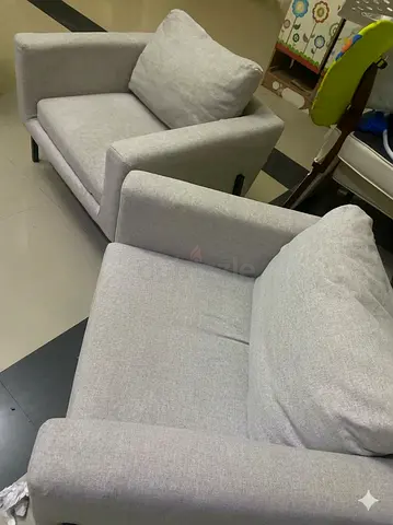 Pair of light grey fabric armchairs - good condition