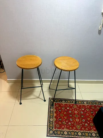 Set of 2 simple wooden round bar stools with black metal legs