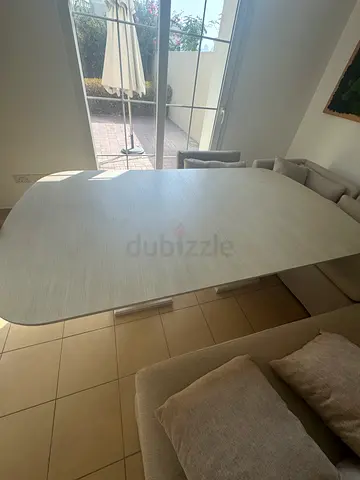 Light wood dining table, seats 6-8, good condition