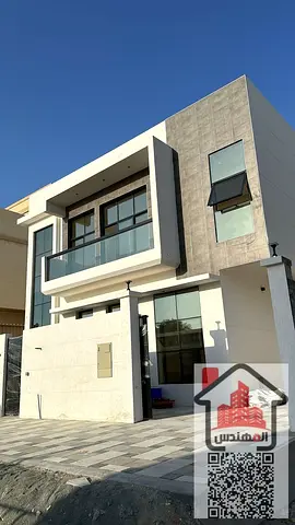 Two-story villa for rent in Ajman, Al Yasmin area. 5 master bedrooms, living room, majlis, and maid's room. Rent: AED 100,000