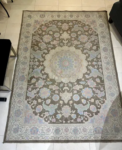 Persian-style floral rug - neutral tones, good condition